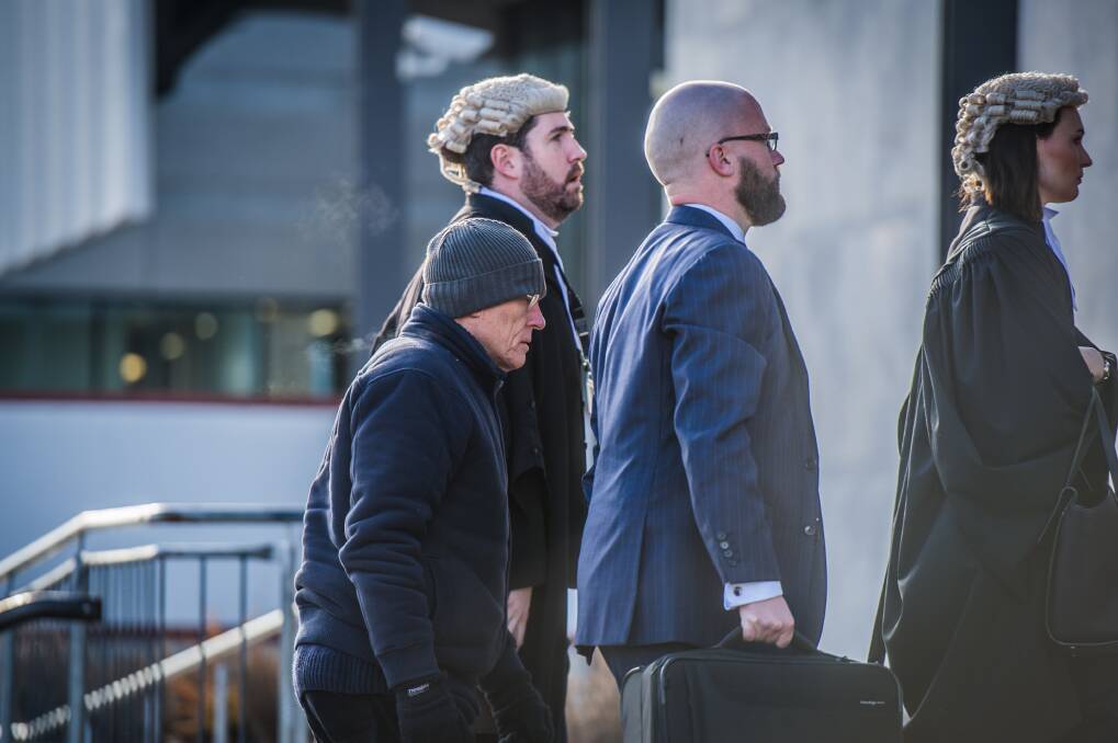 David Eastman, left, arrives at court with his legal team earlier in this trial. Photo: Karleen Minney