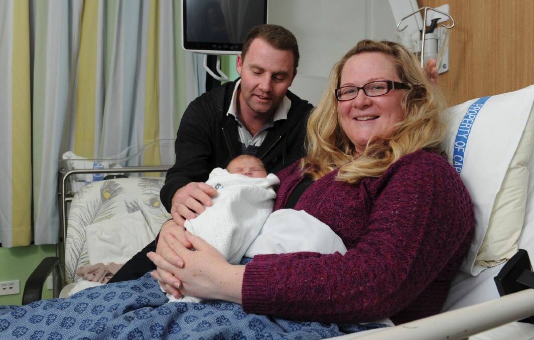 Lucy Grace Cassells - with her mother Amy Hicks and father Nick Cassells - was the 1000th baby born in the CaTCH program.  Photo: Graham Tidy