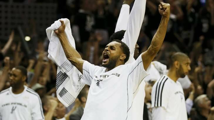 San Antonio Spurs' Patty Mills celebrates during play against the Miami Heat during the fourth quarter of Game 3 of their NBA Finals basketball playoff in San Antonio, Texas June 11, 2013. REUTERS/Lucy Nicholson (UNITED STATES  - Tags: SPORT BASKETBALL) Photo: LUCY NICHOLSON