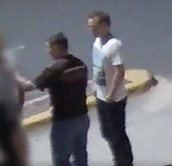CCTV footage shows the man in the white shirt seconds before he punched the man in the dark shirt to the ground.  Photo: Screenshot
