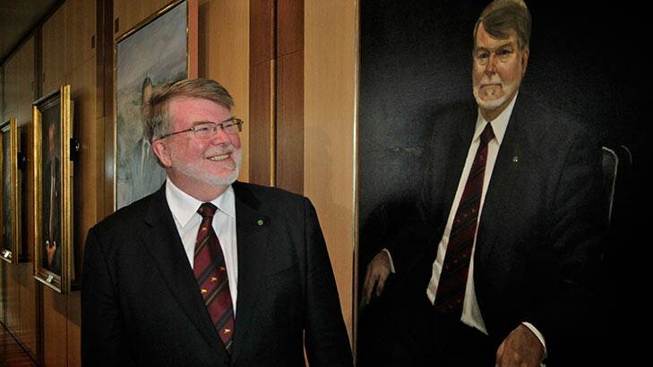 Former Speaker Harry Jenkins poses with his portrait that was unveiled at Parliament House in Canberra on Friday. Photo: Andrew Meares