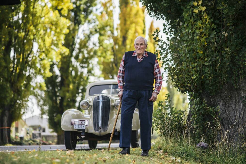Keven Burke who helped plant poplars in his home town, Berridale, as a 10-year-old in 1935. In the background is  his 1936 Chevrolet. 

 Photo: Rohan Thomson