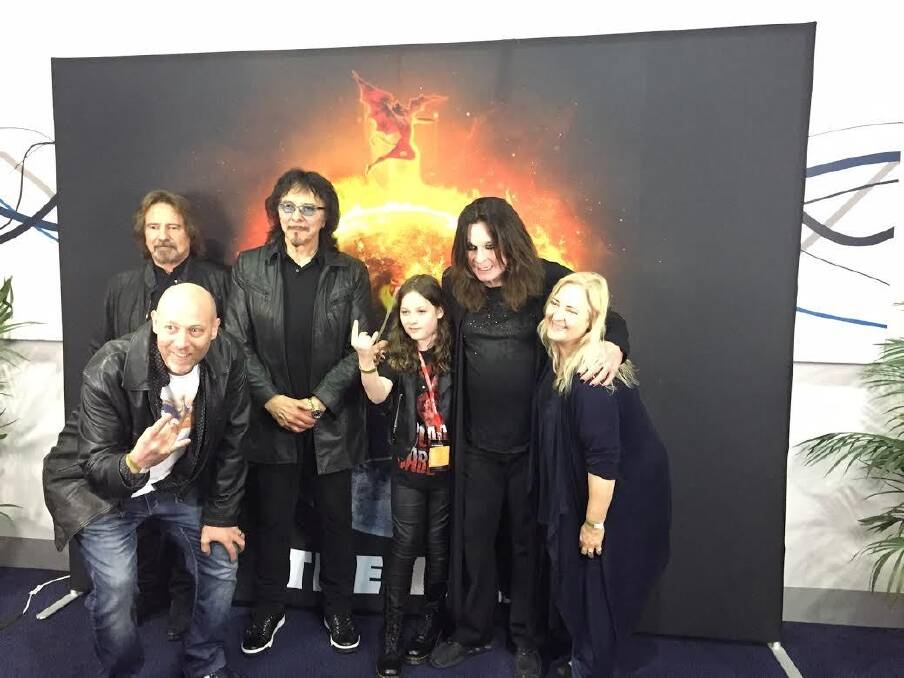 Canberra schoolboy Callum McPhie, 11, with his dad Doug McPhie (front) and mum Melissa Freeman meeting Black Sabbath members (l-r) guitarists Geezer Butler and Tony Iommi and frontman Ozzy Osbourne before their Sydney concert on April 23. Photo: Supplied