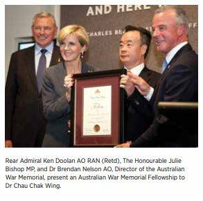 A photo from the Australian War Memorial's 2015-16 annual report, showing Rear Admiral Ken Doolan (retired), Foreign Minister Julie Bishop, Dr Chau Chak Wing and memorial director Dr Brendan Nelson. Ms Bishop is presenting the Australian War Memorial fellowship to Dr Chau.