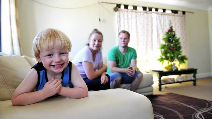 The Smith family, Matthew, Courtenay (corr)and son Leo, 3, happy to be in their new in home before Christmas after it took three years to build. Photo: Jay Cronan