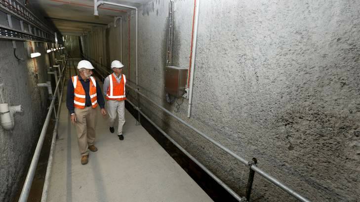 MONUMENTAL: Above, John Dymke, left, shows Richard Begbie through the gallery of the new Cotter Dam. Photo: Jeffrey Chan