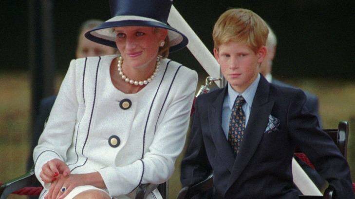 Princess Diana and Prince Harry in 1995: A biography of Diana's younger son claims she was a manipulative, paranoid mother. Photo: AP