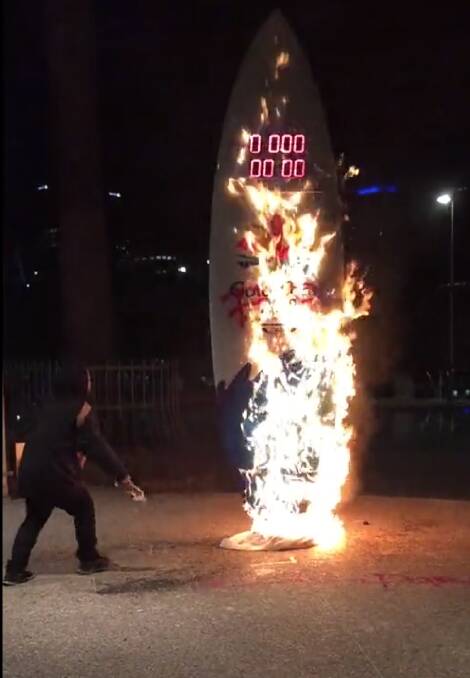Activists torch Commonwealth Games countdown clock at South Bank. Photo: Supplied