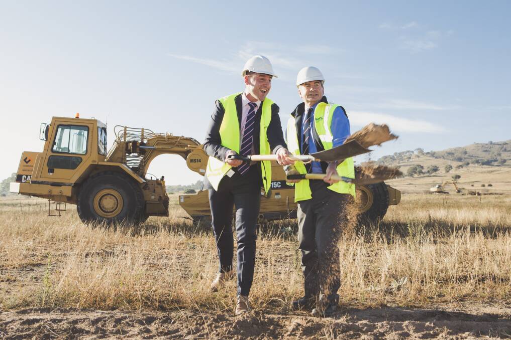 Village Building Co. chief executive Travis Doherty and Queanbeyan-Palerang Regional Council mayor Tim Overall turn the first sod at the $1 billion South Jerrabomberra estate on Wednesday morning. Photo: Jamila Toderas