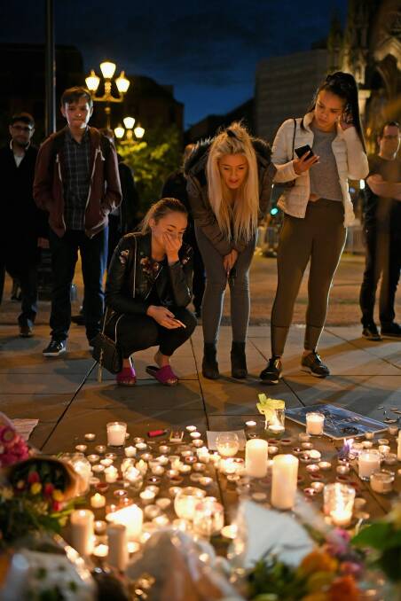 MANCHESTER, ENGLAND - Members of the public attend a candlelit vigil, to honour the victims of Monday evening's terror attack. Photo: Jeff J Mitchell/Getty Images