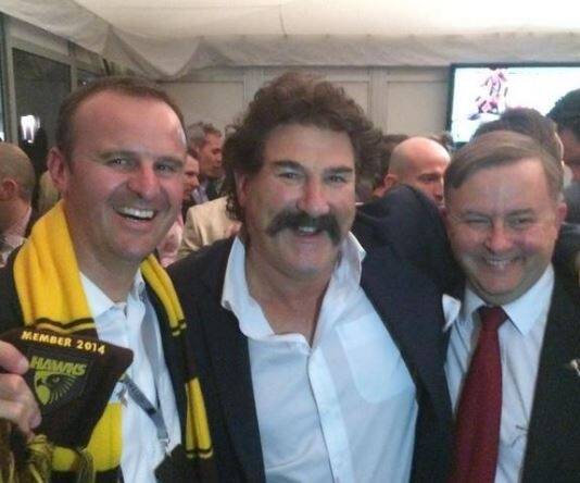 Andrew Barr, a self-described Hawthorn tragic. He tweeted this picture from the 2014 grand final, taken with Hawthorn legend Robert Dipierdomenico and Labor MP Anthony Albanese. He did not claim a taxpayer subsidy for this trip. Photo: Andrew Barr/Supplied