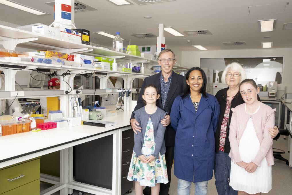 Cancer researcher Professor Sudha Rao (centre) at the Melanie Swan Memorial Translational Centre with Melanie's parents David and Carol Swan, and daughters Sophie (8) and Emma (11) Chamberlain. Photo: Sitthixay Ditthavong