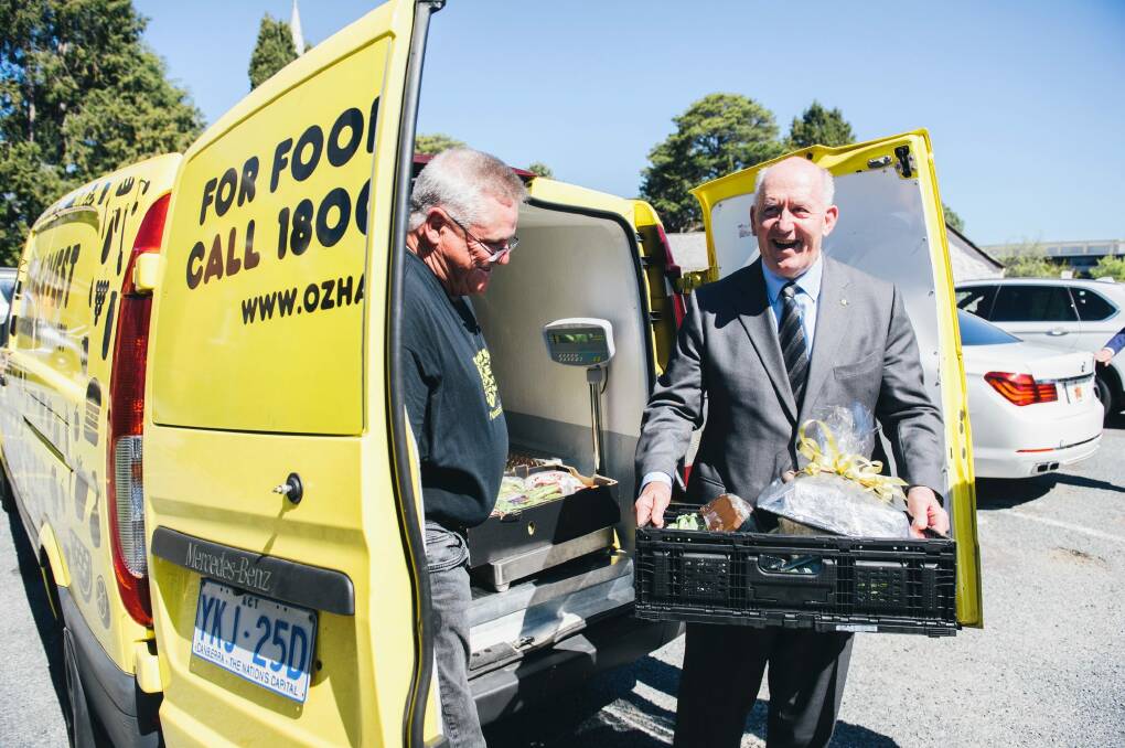 OzHarvest Canberra manager Dave Burnet with Governor General Peter Cosgrove outside the charity's headquarters at St John's Anglican Church in Reid. Photo: Rohan Thomson