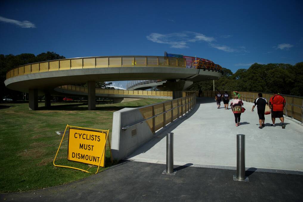 Pedestrians using the Albert "Tibby" Cotter Bridge over Anzac Parade. Photo: Wolter Peeters
