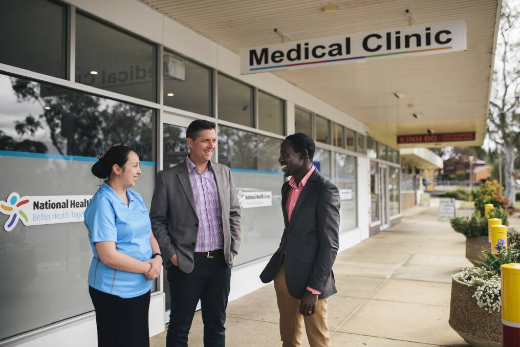 Nurse Kieth Ancheta, left, director Adrian Watts and medical director Joe Oguns outside the National Health Co-op medical clinic in Macquarie. 
 Photo: Rohan Thomson