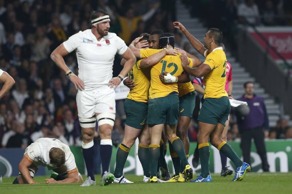 Chariot swinging low: Australian players celebrate as England are left to ponder what went wrong.  Photo: AP