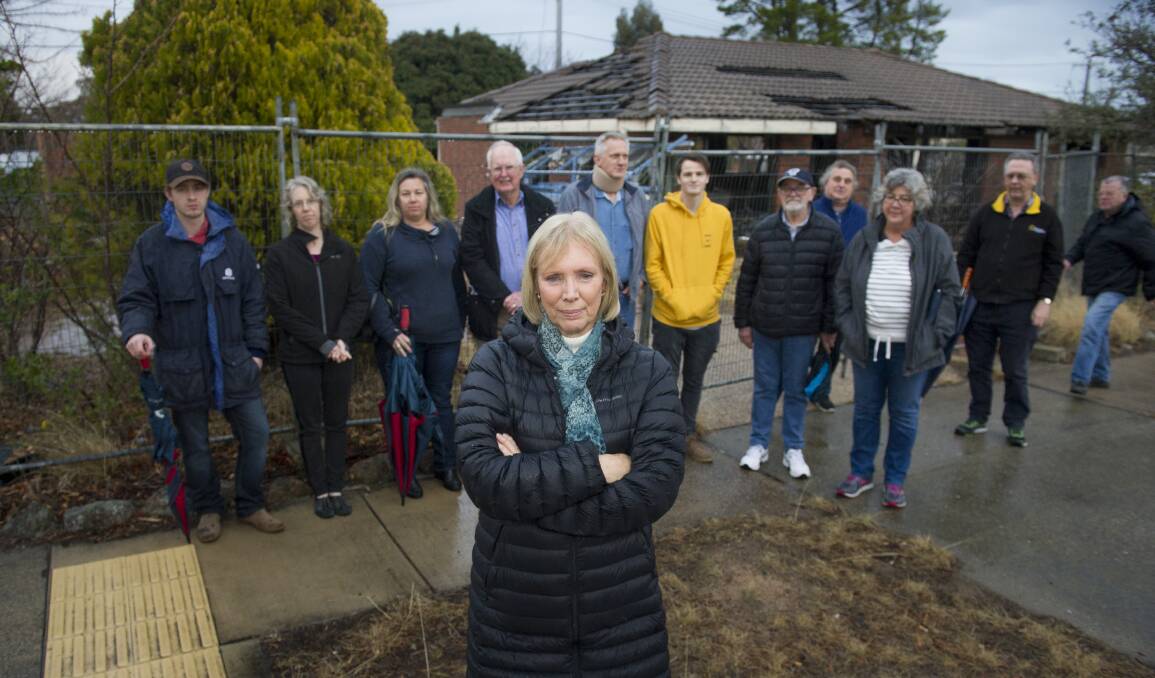 Pam Cogar with fellow Kambah residents who are concerned over a half-demolished house that has been there for several years. Photo: Elesa Kurtz