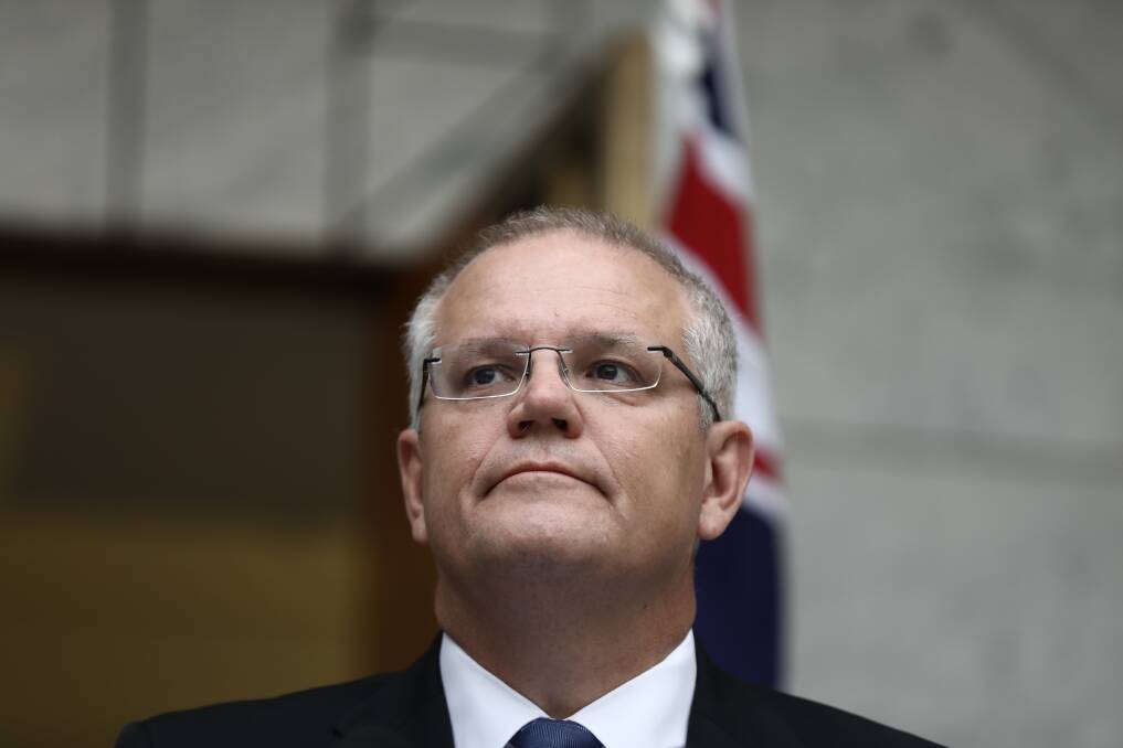 Prime Minister Scott Morrison, pictured on Friday, goes into the election leading a minority government. Photo: Dominic Lorrimer