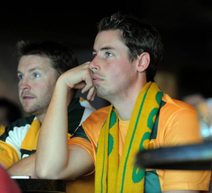 J.P McCann (left) and Ben Meyer, both from Bonner, watching the Australia vs Chile match at the Civic Pub in Braddon. Photo: Graham Tidy