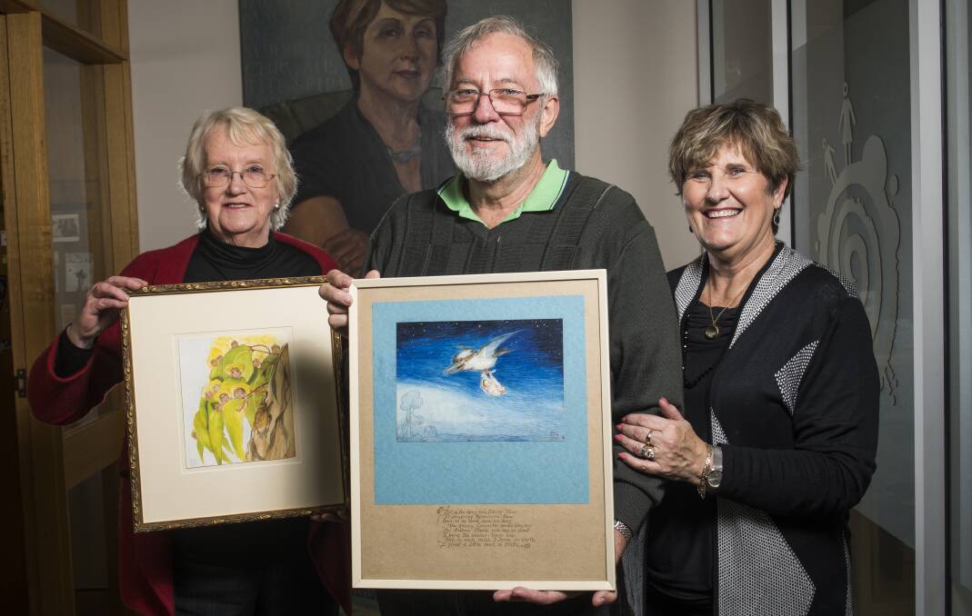 Jane Brummitt, left, and Geoff and Amanda Turville with their rare paintings.  Photo: Elesa Kurtz