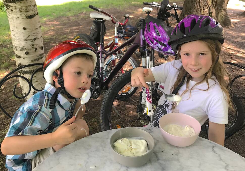 Tim's eight-year-old daughter Emily (right) and her five-year-old cousin Lachlan Hartmann enjoy an ice cream break while riding around Yarralumla. Photo: Tim the Yowie Man