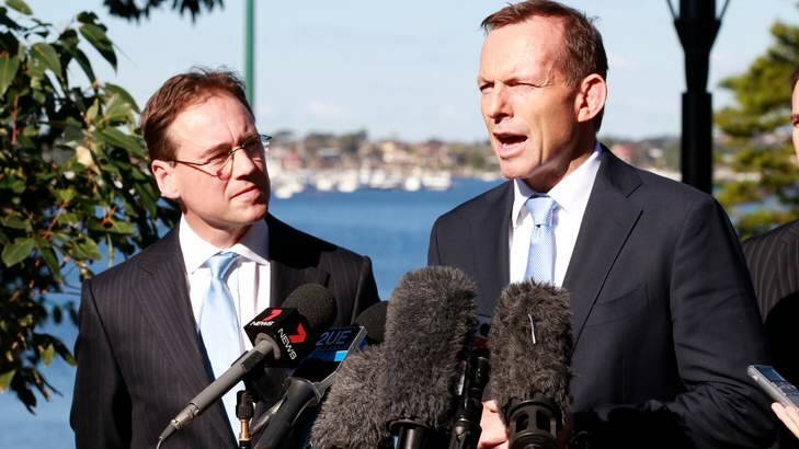Opposition leader Tony Abbott in Sydney earlier this month with Coalition environment spokesman Greg Hunt. The Coalition has attacked the government's move to an emissions trading scheme earlier than planned. Photo: Edwina Pickles