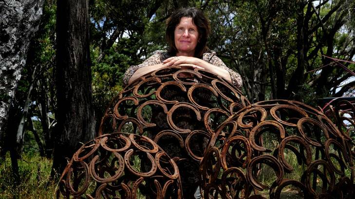 Melinda Knowles of Mittagong with her horse shoe garden art at the Hall Markets. Photo: Melissa Adams