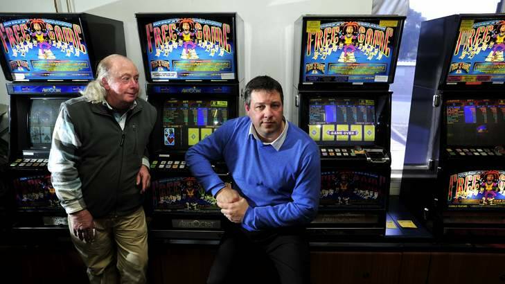 Darcy Henry, left,  owner of Moby Dick's Tavern, Holt and Paul Berger, Fyshwick Tavern owner, with the outdated poker machines at the Fyshwick Tavern. Photo: Melissa Adams