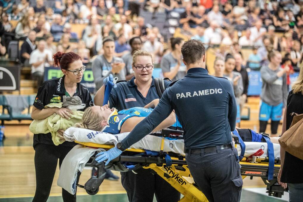 Canberra?s Rachel Jarry, kneck in a brace, is assisted from the Dandenong court by paramedics. Rachel was injured in a simple rebounding contest and immediately clutched her head and appeared distressed. She has suffered a series of concussions in the past. WNBL, Dandenong Rangers v Canberra Capitals, 9/12/2017, Photo: Mick Connolly Canberra?s Rachel Jarry, neck in a brace, is assisted from the Dandenong court by paramedics. Rachel was injured in a simple rebounding contest and immediately clutched her head and appeared distressed. She has suffered a series of concussions in the past. WNBL, Dandenong Rangers v Canberra Capitals, 9/12/2017, Photo: Mick Connolly Photo: Mick Connolly