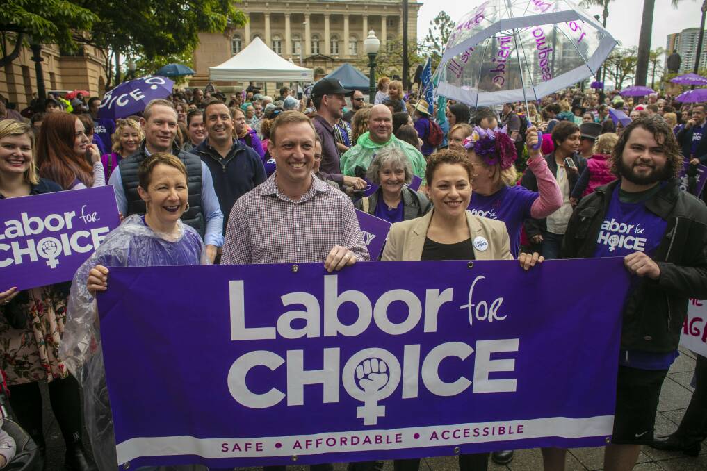Health Minister Steven Miles (second from left) and Deputy Premier Jackie Trad (third from left) are seen attending the March Together for Choice rally in Brisbane ahead of proposed changes to Queensland's abortion laws. Photo: Glenn Hunt/AAP