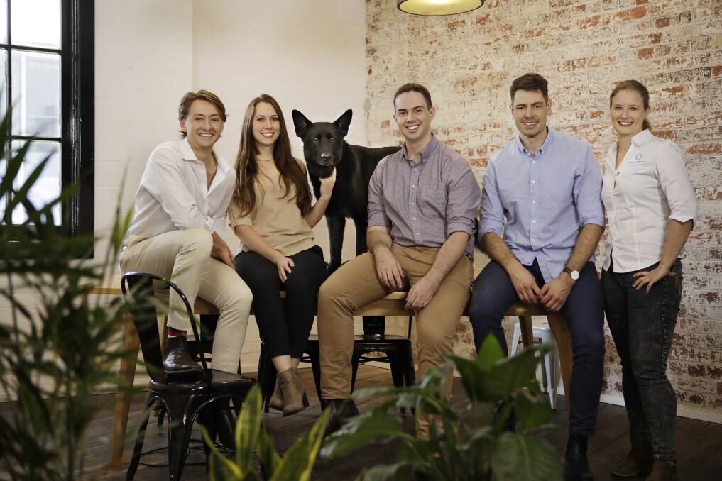 Elliot Smith (centre) and the Maxwell Plus team from the Brisbane medical technology startup. Photo: Supplied