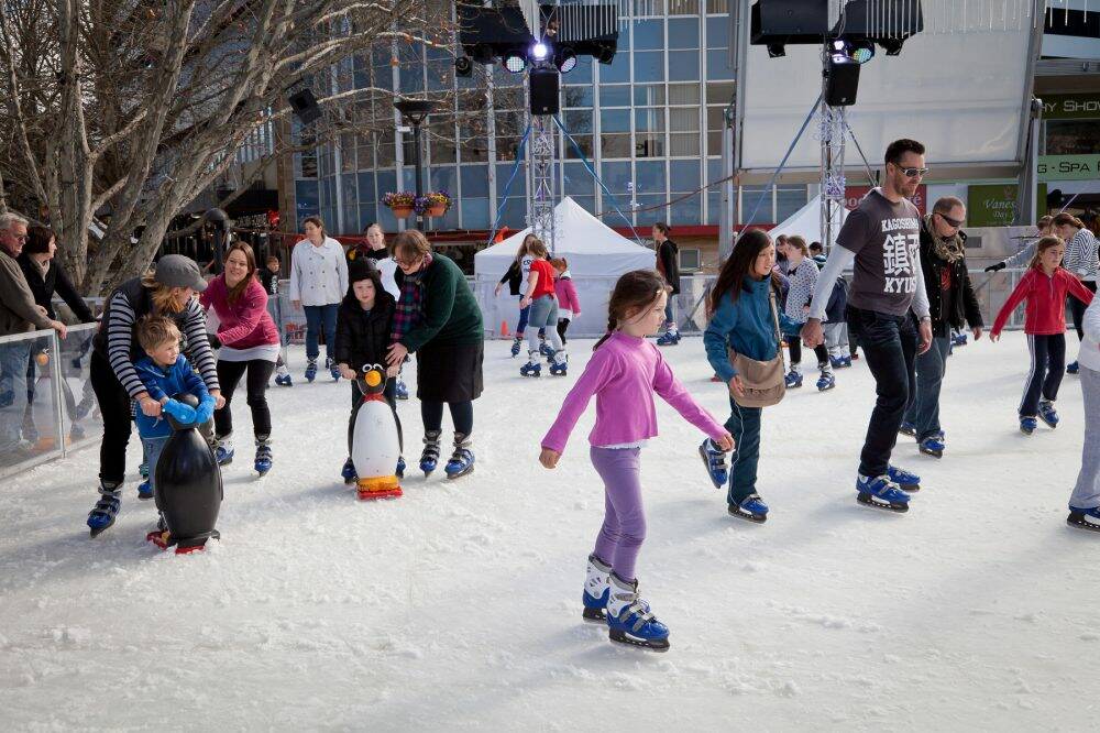 Families take to the ice for Skate in the City at Garema Place.