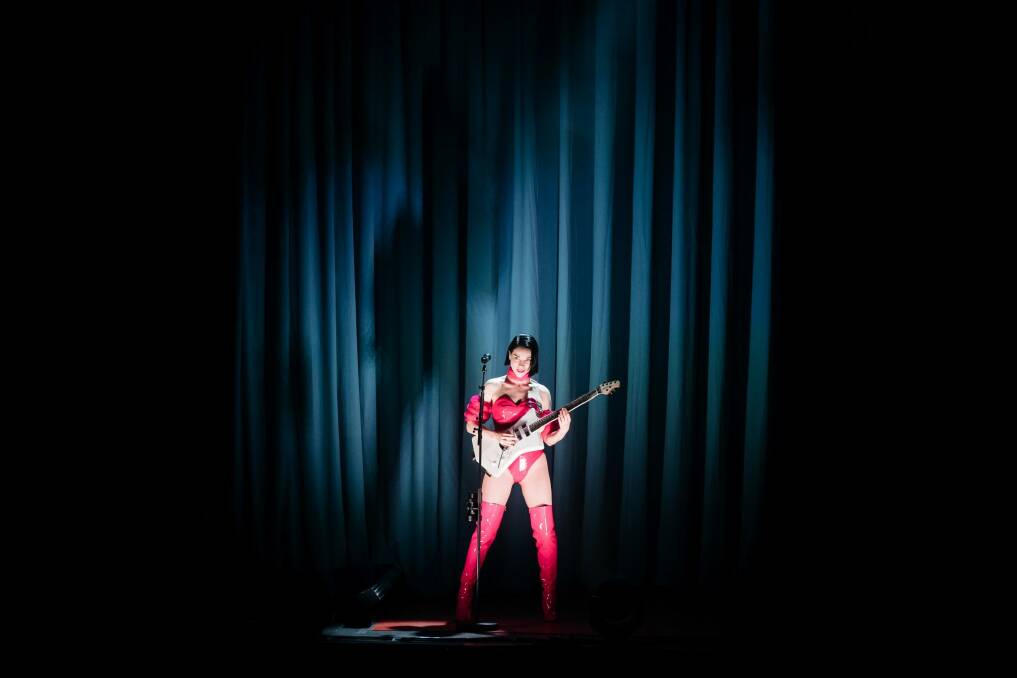 St. Vincent at Carriageworks. A red rubber leotard didn't seem  quite enough to keep warm in the  cavernous, chilly shed. Photo: Daniel Boud