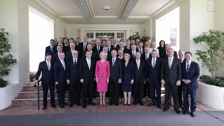 Governor-General Quentin Bryce poses for photos with Prime Minister Tony Abbott and his new ministry at Government House in Canberra on Wednesday. Photo: Alex Ellinghausen