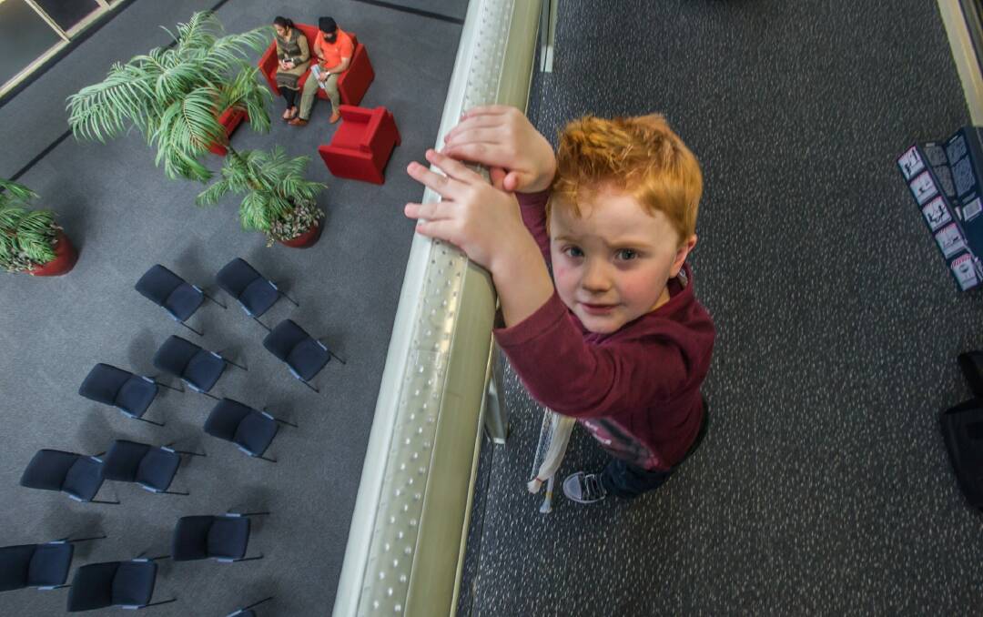Lennon Markwart, 4, tries out the Anti Grabbity – a Canberra-designed device intended to prevent children from climbing and falling off balconies. Photo: Karleen Minney