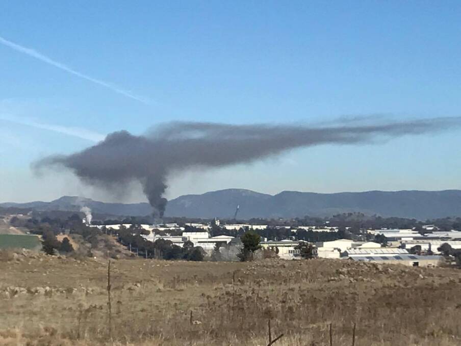 Black smoke hangs over Hume after reports of a fire in the industrial zone.  Photo: John Malnar/Facebook