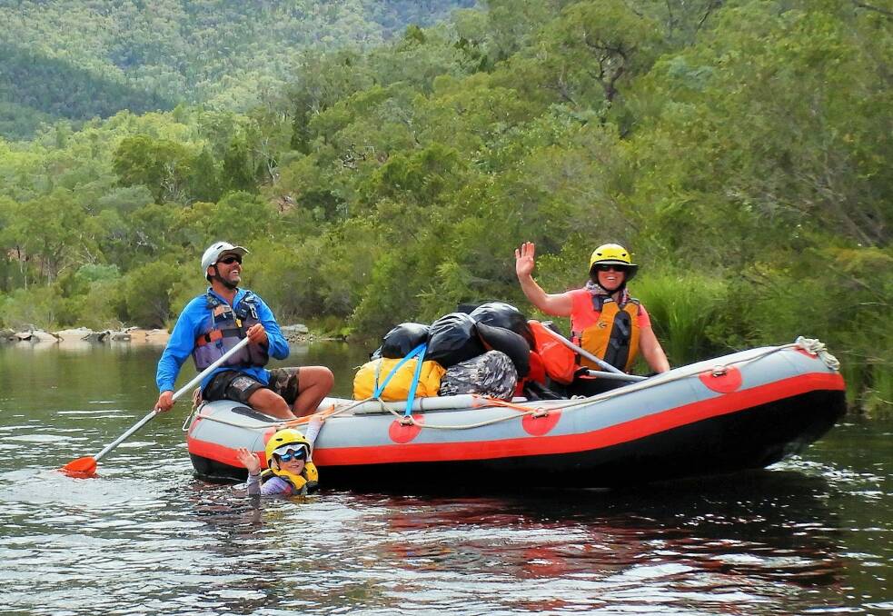 Emily enjoys a refreshing dip while Mrs Yowie and river guide Richard Swaine look on. Photo: Tim the Yowie Man