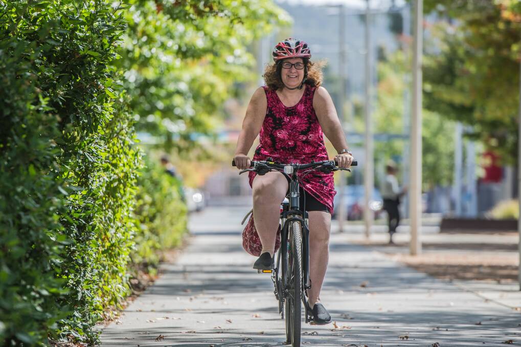 Elizabeth Zatschler rides her bike in central Canberra, near her office. Photo: Karleen Minney
