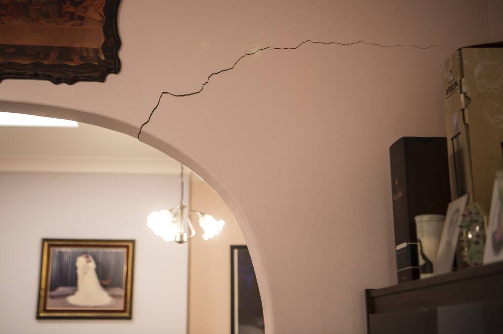 He heard a splitting noise when a crack above an archway in his lounge room appeared.  Photo: Wolter Peeters