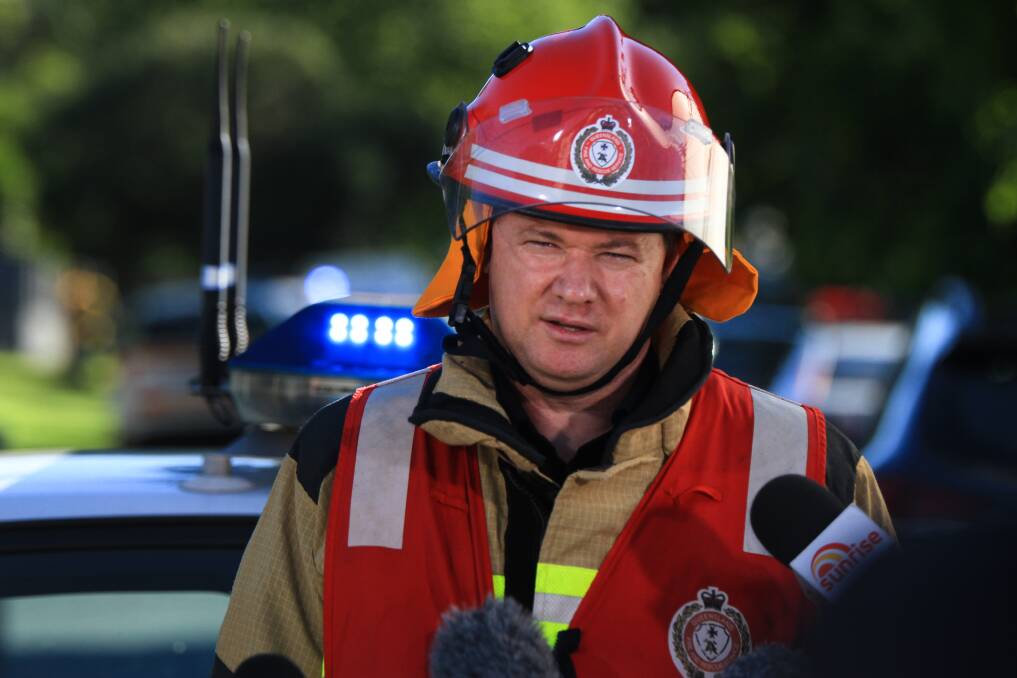 Queensland Fire and Emergency Service Inspector Bevan Moore addresses the media. Photo: Jorge Branco