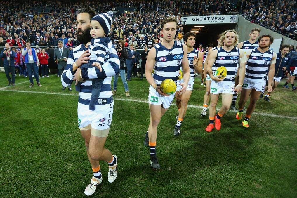 Jimmy Bartel leads his side onto Simonds Stadium. Photo: Getty Images