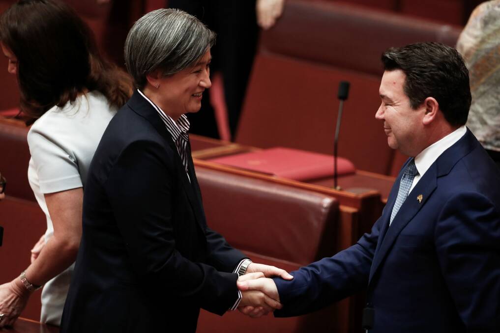 Labor's Penny Wong congratulates Smith after his speech.  Photo: Alex Ellinghausen