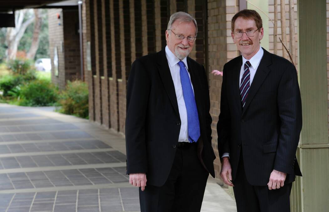Chancellor Gareth Evans with outgoing Vice-Chancellor Ian Young. Photo: Lannon Harley
