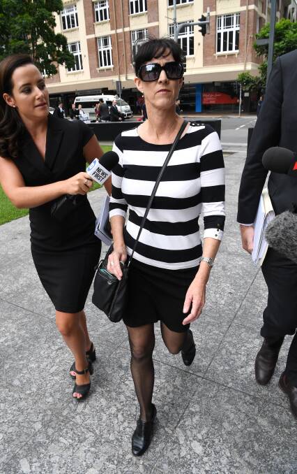 Sharon Oxenbridge, the wife of Wulff, arrives at the District Court in Brisbane. Photo: AAP Image/Dan Peled