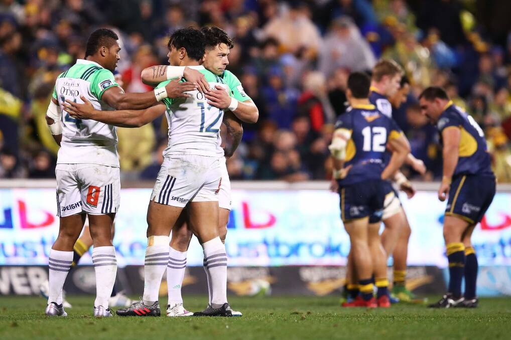 Victors and vanquished: Highlanders celebrate at full-time. Photo: Getty Images
