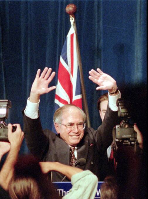 Liberal Party leader John Howard waves to the crowd after his victory in the 1996 election. Photo: Rick Rycroft