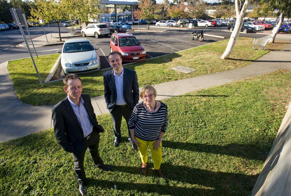 Shane Rattenbury, Minister Andrew Barr and Pat McGinn are pleased with car parking upgrades as part of the Weston Creek Group Centre development. Photo: Elesa Kurtz