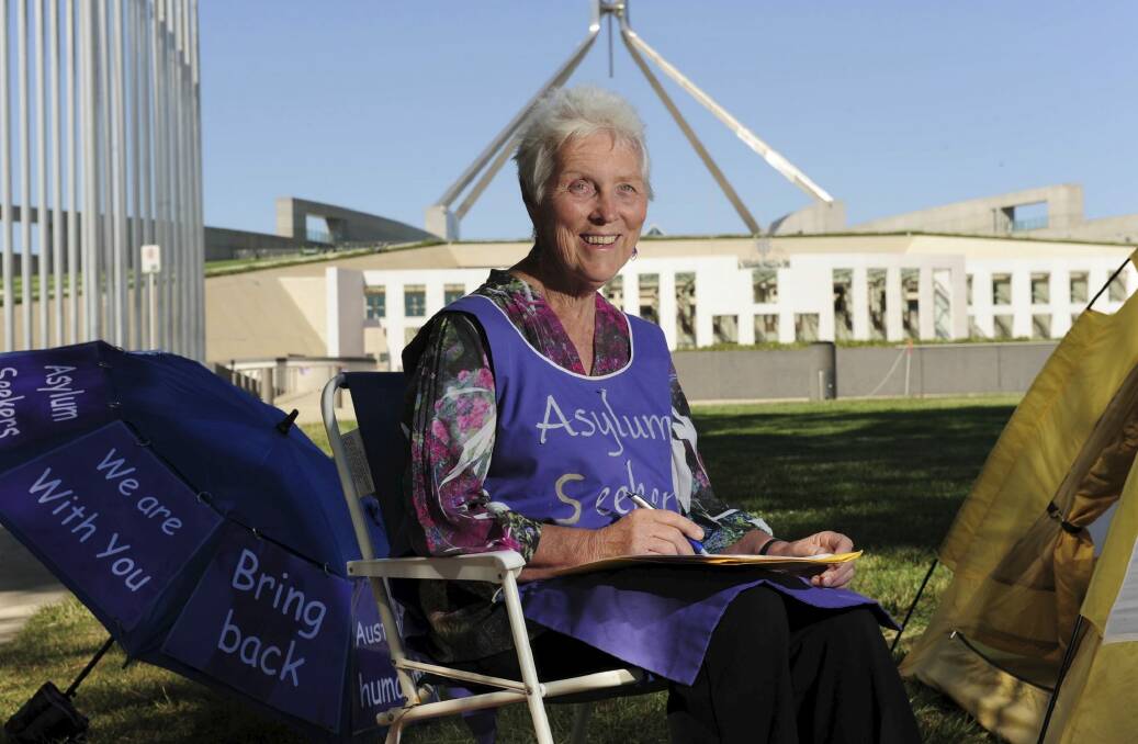 Sister Jane Keogh, continues her lone vigil in front of Parliament House, Canberra. She supports refugees and stands in solidarity with asylum seekers on Nauru and Manus Island. Photo: Graham Tidy
