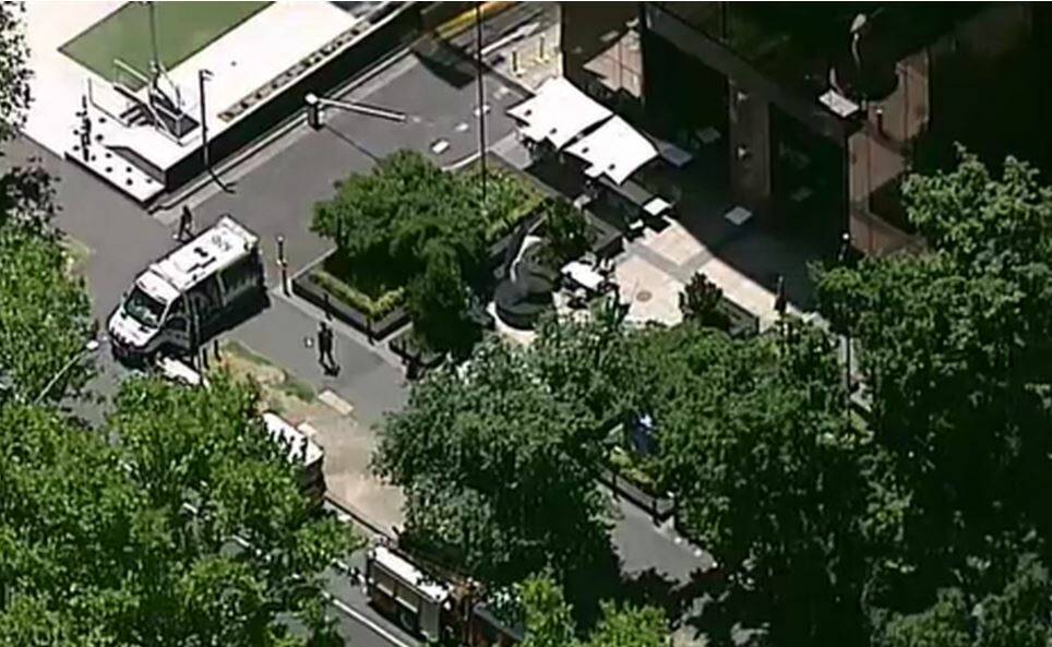 Emergency services at the scene on St Kilda Road, where both the US and Indian consulates are located Photo: Nine News