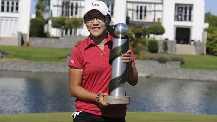 Teen star Lydia Ko shows off the spoils of her victory.